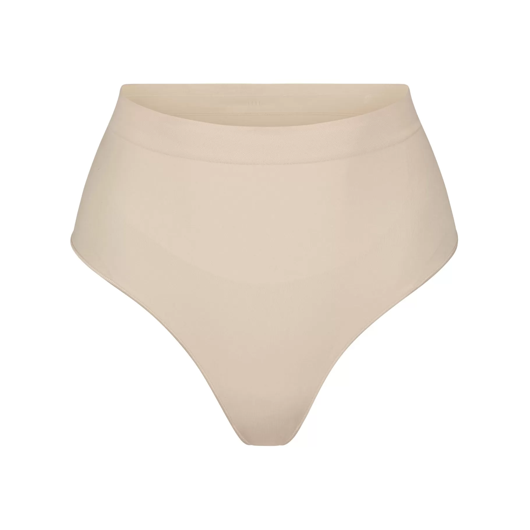 Skims seamless sculpt*SEAMLESS SCULPT MID WAIST THONG | SAND