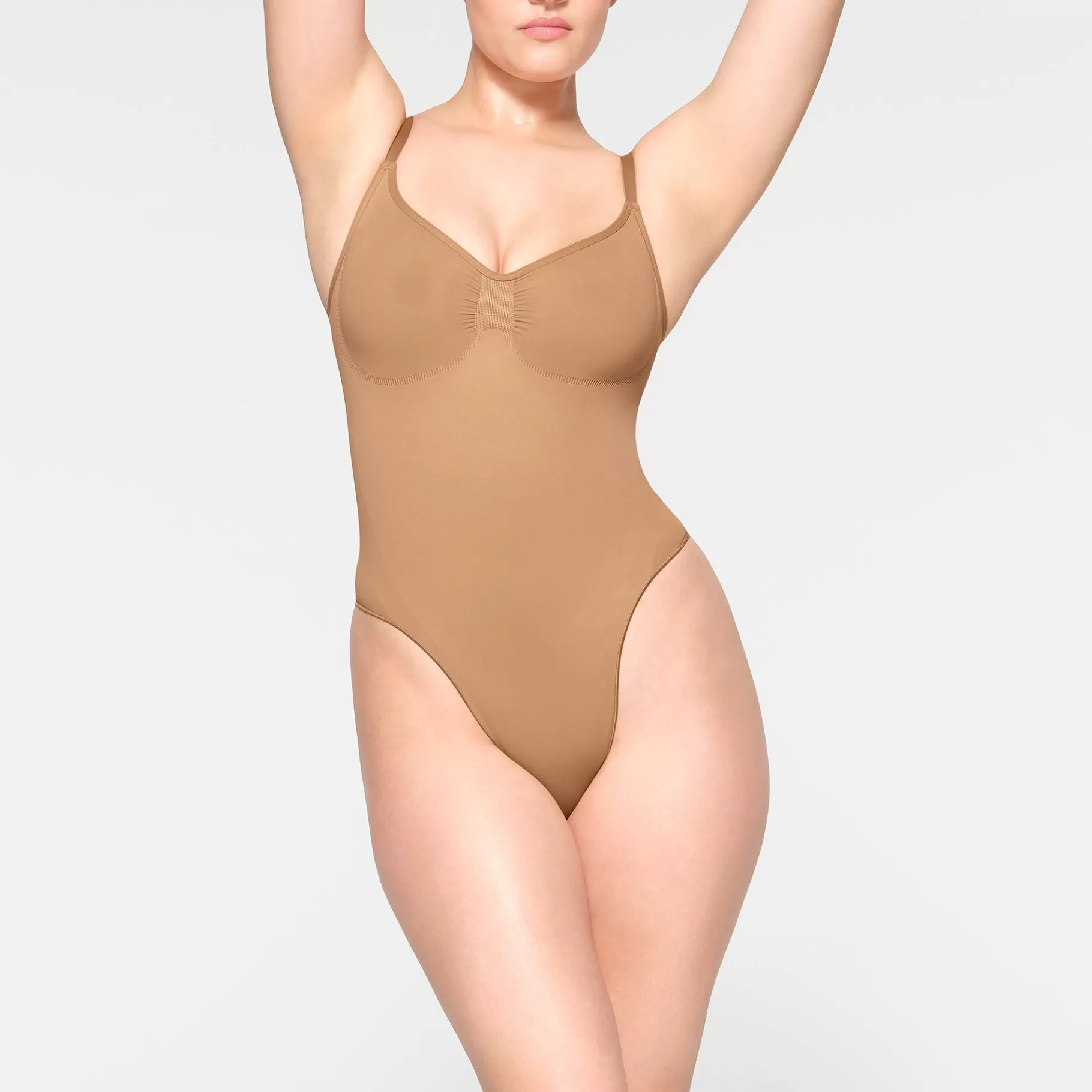 Skims shapewear bodysuits*SEAMLESS SCULPT THONG BODYSUIT | OCHRE